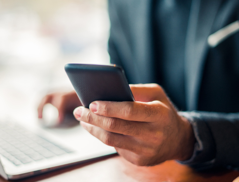 A businessperson using a mobile phone