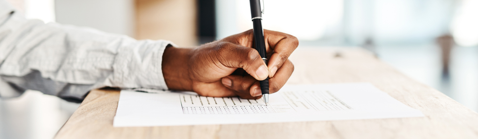 A man writing on a form