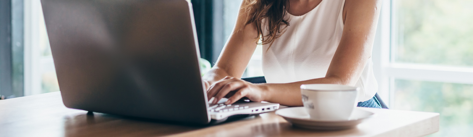 woman typing on a laptop