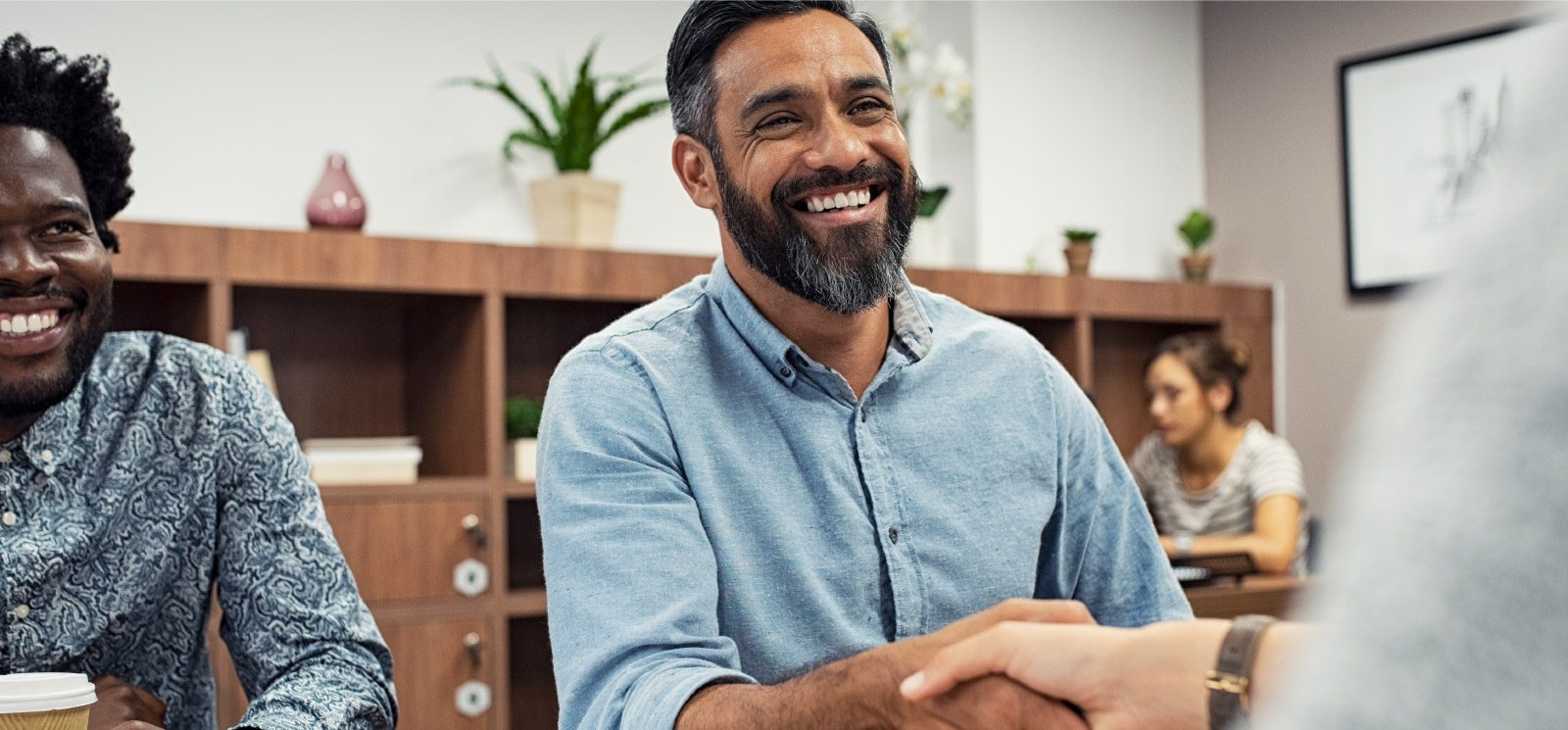 A man shaking hands in an office